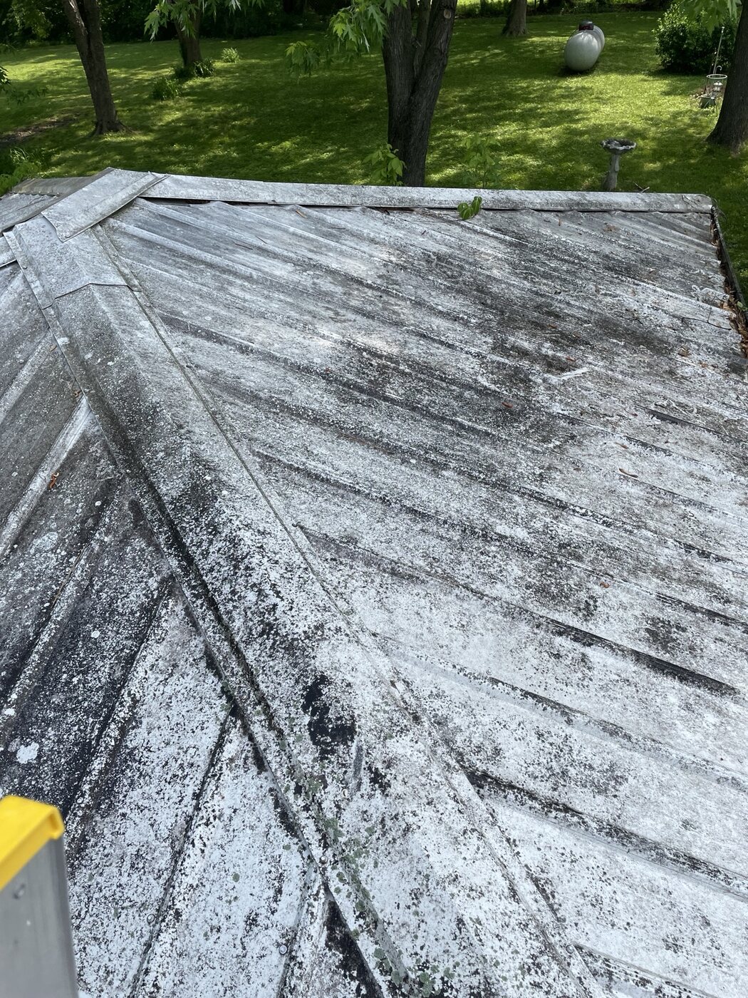 Stained metal roof before cleaning